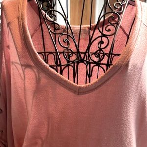 Cute pink quarter sleeve sweater material too with cutout shoulders